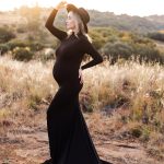 Maternity-dress-rental-black-high-neck-fitted-dress-with-skirt-2